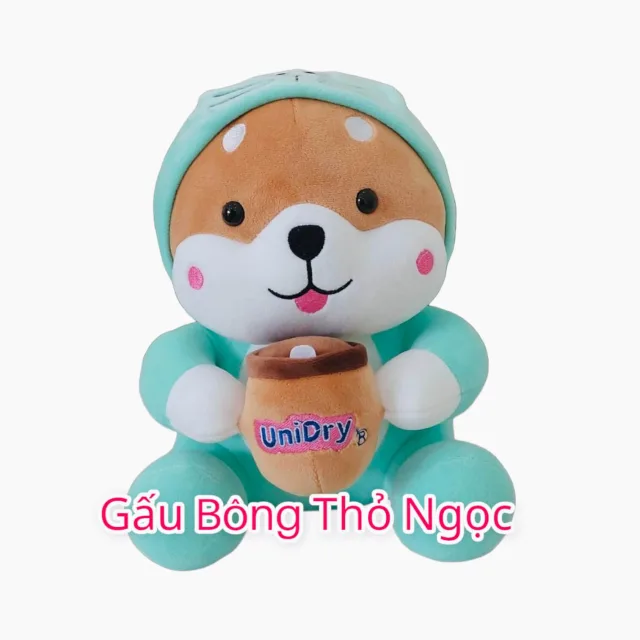 Chó Shiba bông mặc áo khủng long xanh